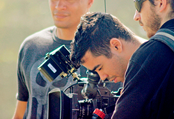 student operates a video camera