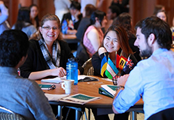 study abroad students talking at table