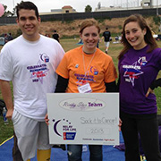 Three Student volunteers holding Relay for Life sign